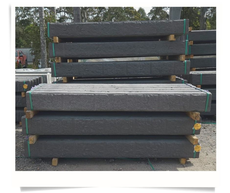 Stacks of Gray Rectangular Concrete Beams on Wooden Pallets, Outdoors — Concrete Sleepers NSW in Sancrox, NSW