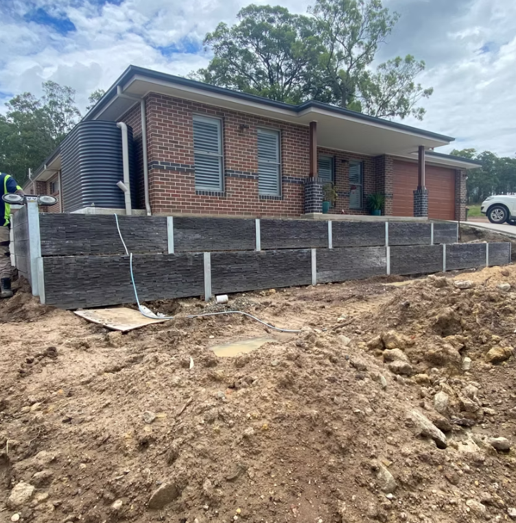House With a Multi-level Timber Retaining Wall, Built on a Sloped Yard — Concrete Sleepers NSW in Sancrox, NSW