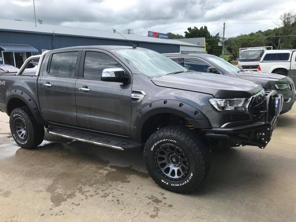 A Ford Ranger Pickup Truck Is Parked In Front Of A Building — Staunch Window Tinting In South Lismore, NSW