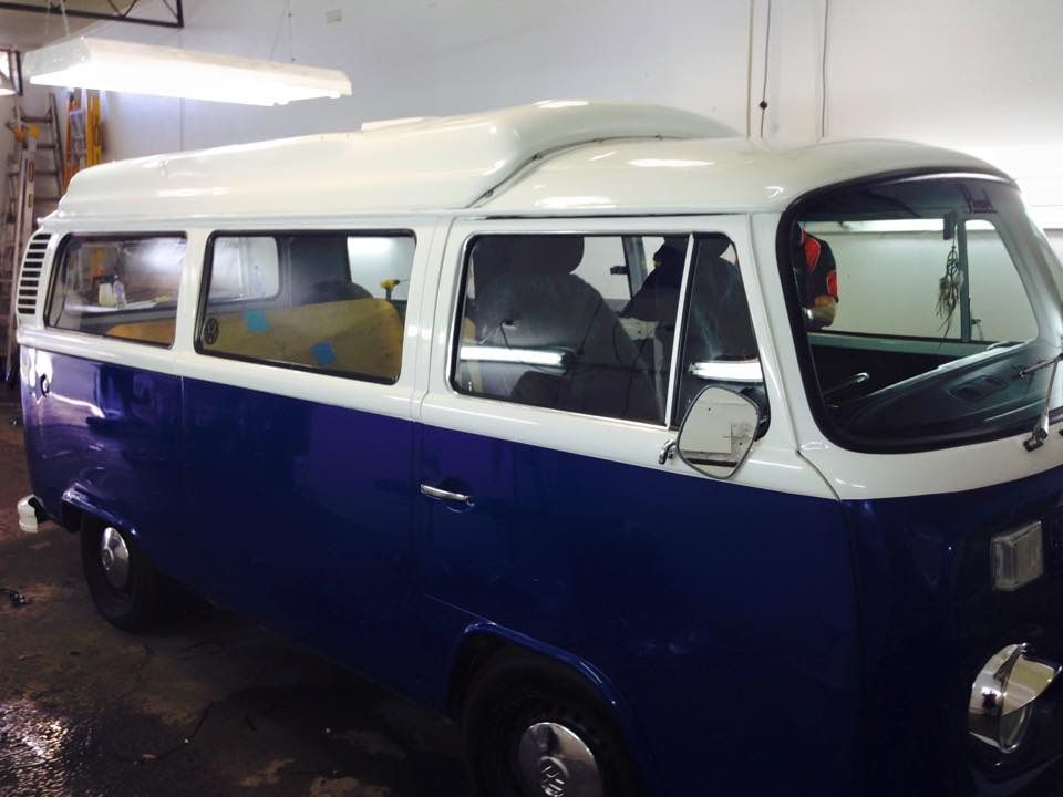 A Blue And White Van Is Parked In A Garage — Staunch Window Tinting In South Lismore, NSW