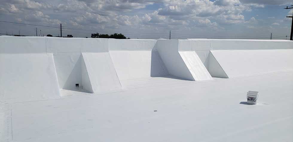 A white roof with a lot of triangles on it.