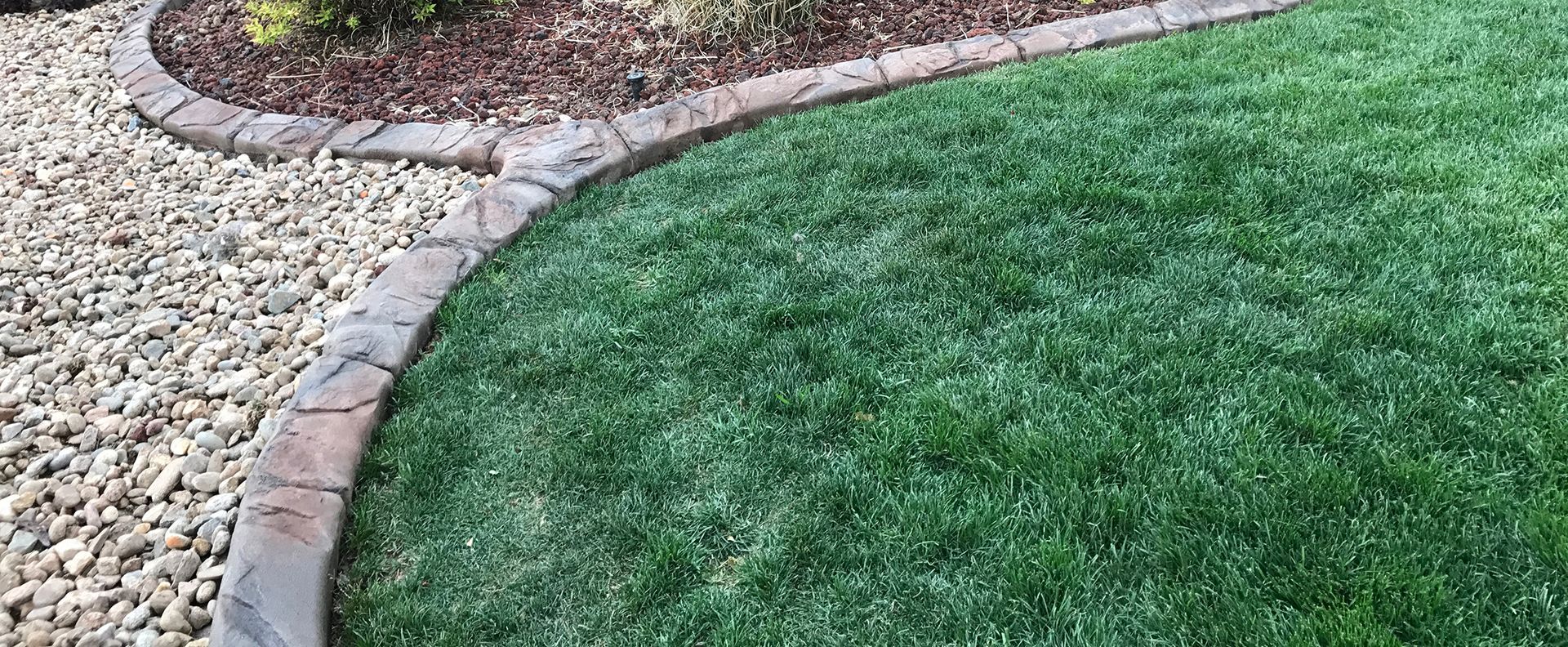 A white van with a toilet in the back is parked on the side of the road.