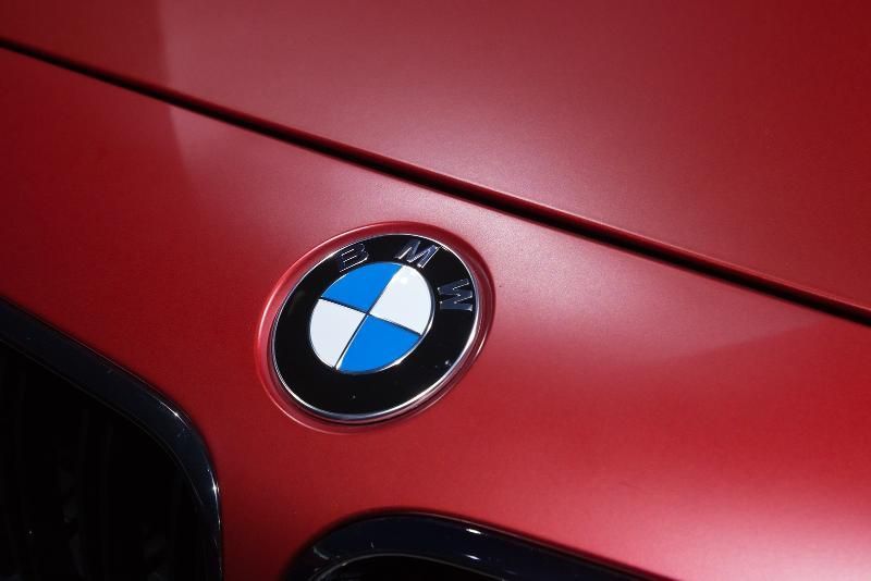 A Close up Of a Bmw Emblem on A Red Car — SVS Autocare in Kunda Park, QLD