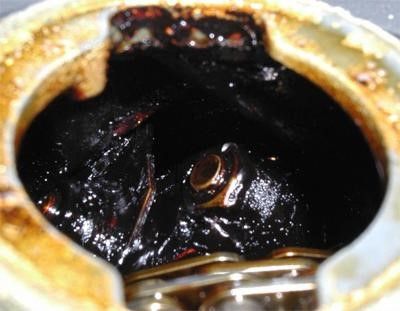 A Close up Of a Black Liquid with A Ring in It — SVS Autocare in Kunda Park, QLD