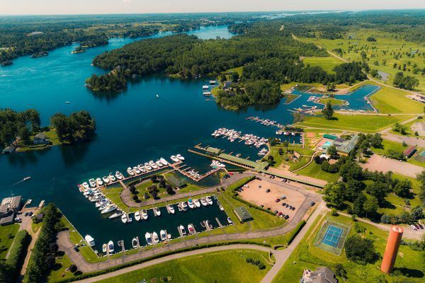 An aerial view of a marina with boats docked in the water