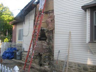 Man Repairing the Chimney — Philadelphia, PA — A & A Chimney Sweep