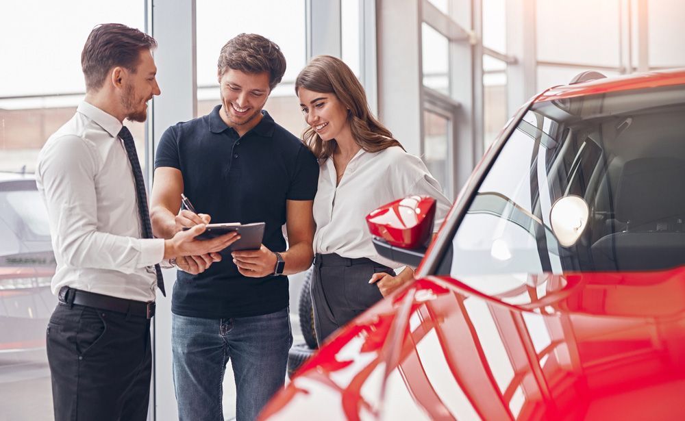 Couple Signing up For a Car Insurance