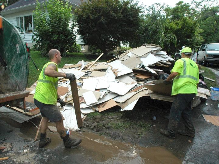 Fema workers performing junk removal service by The U.S. National Archives 