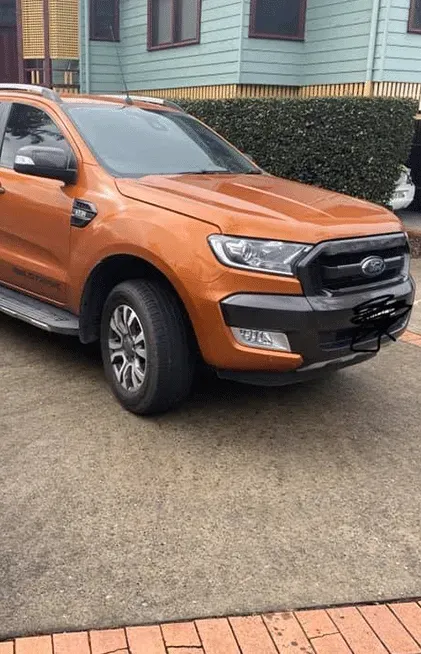 Orange Ford Ranger Truck Parked on Concrete, Near a Building — All Pro Locksmiths In Port Macquarie, NSW