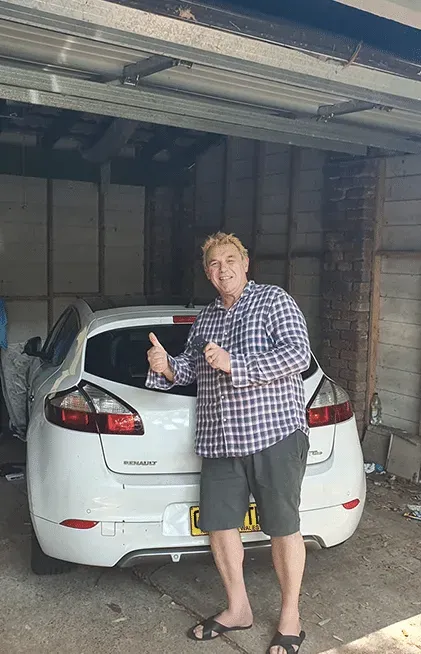 Man in a Checkered Shirt Gives Thumbs Up — All Pro Locksmiths In Port Macquarie, NSW