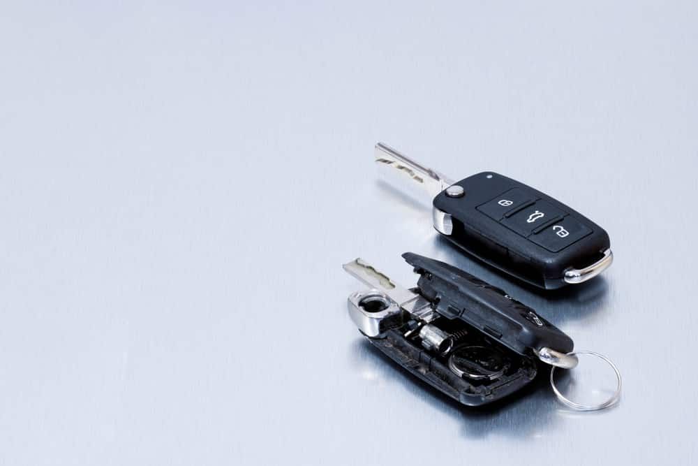Two Car Keys on a Shiny Silver Surface — All Pro Locksmiths In Port Macquarie, NSW