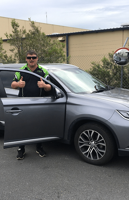Man in Green-trimmed Shirt Gives Thumbs Up — All Pro Locksmiths In Port Macquarie, NSW
