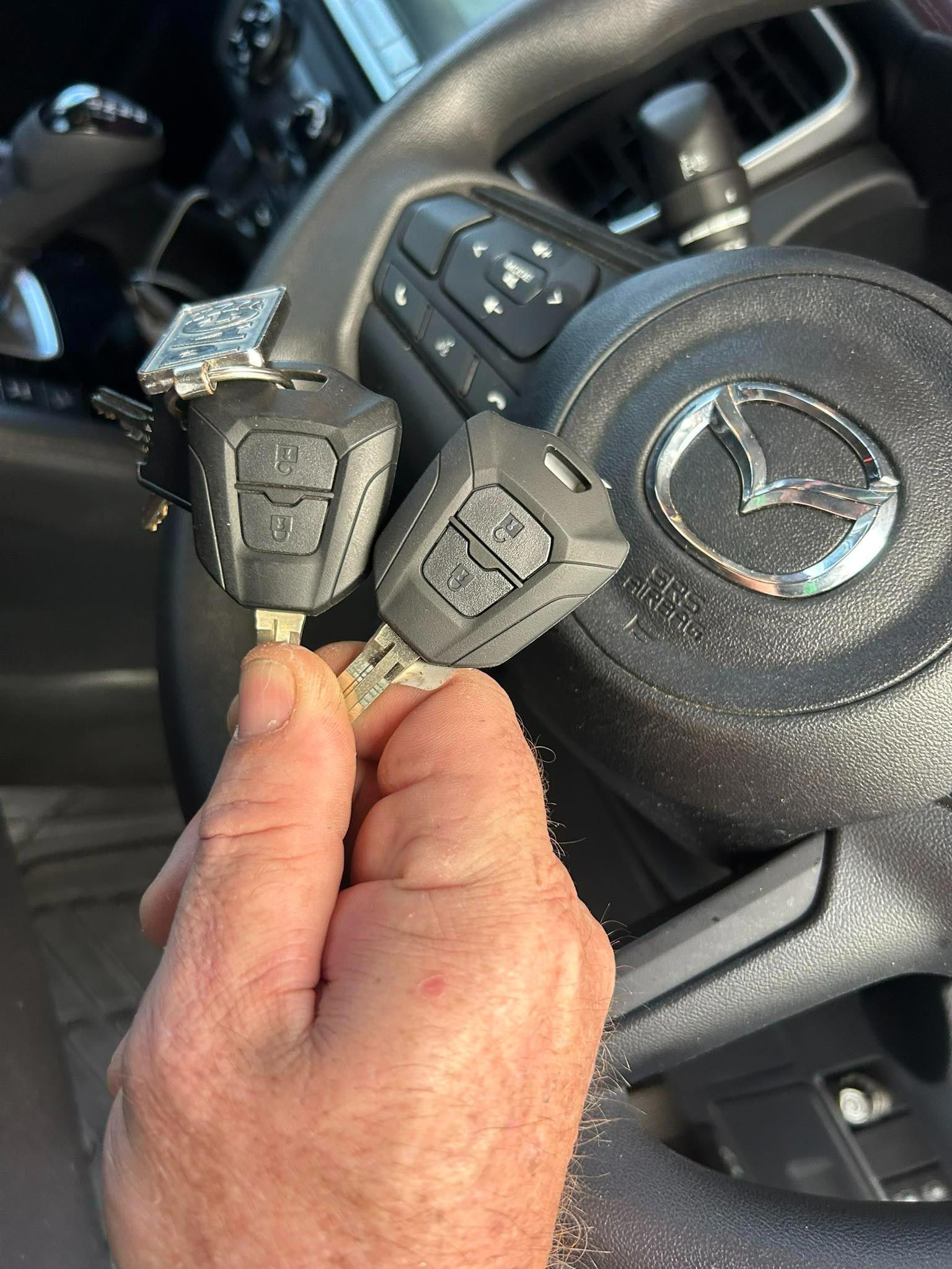Hand Holding Two Car Keys — All Pro Locksmiths In Port Macquarie, NSW