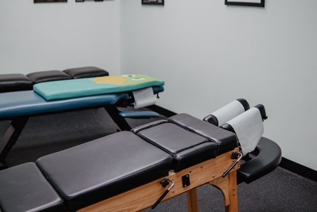 A room with a lot of tables and chairs in it