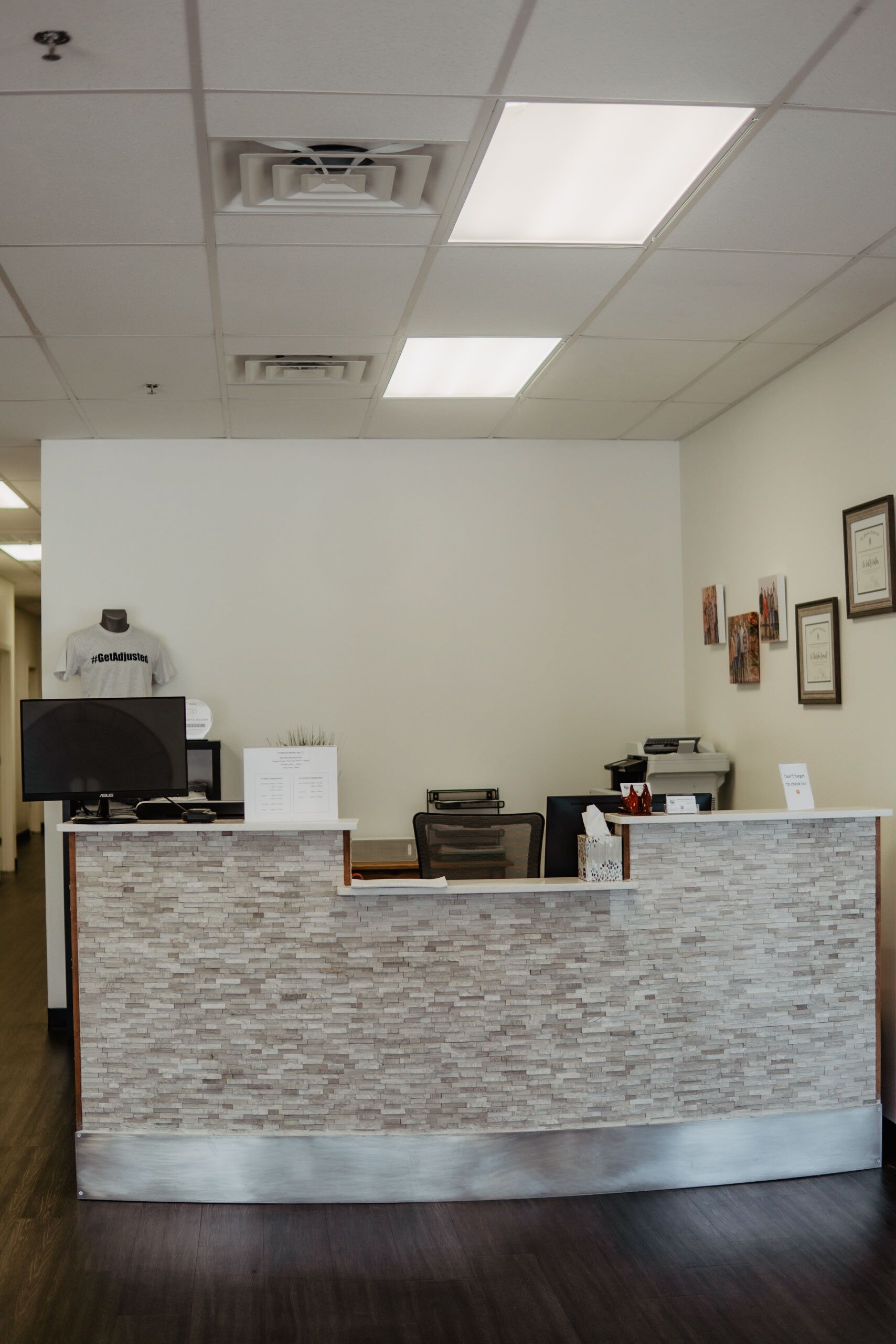 There is a reception desk in the middle of the room.