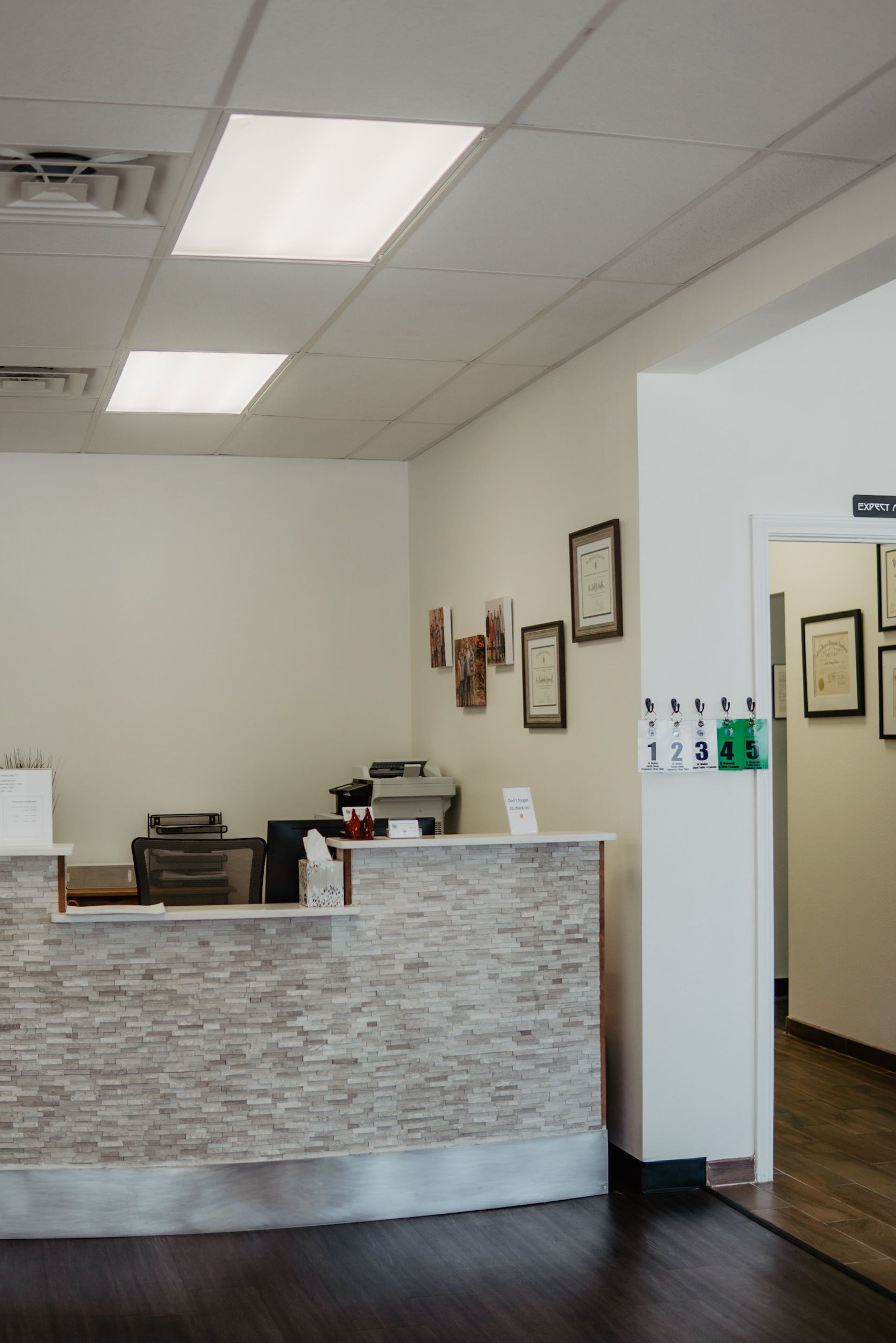 There is a reception desk in the middle of the room.