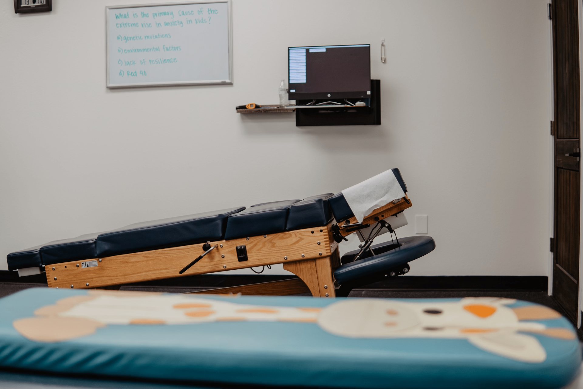 There is a table with a giraffe on it in the room.