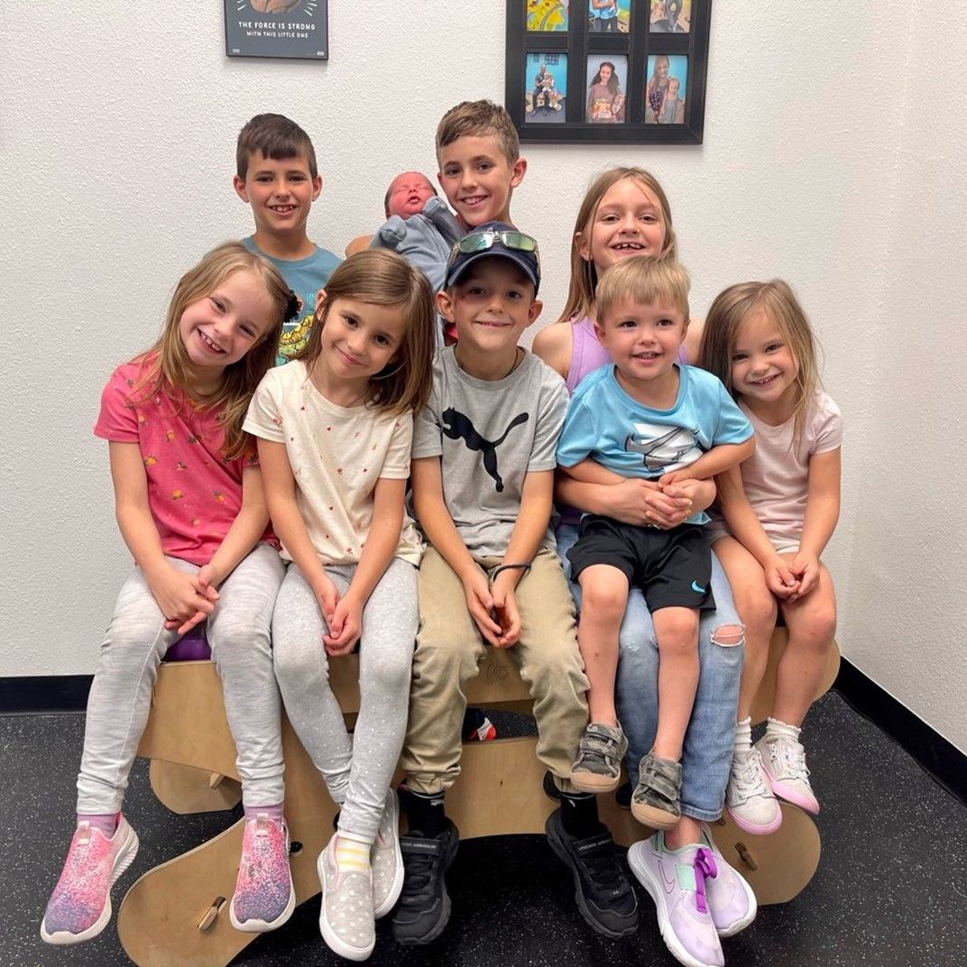 A group of children are posing for a picture together