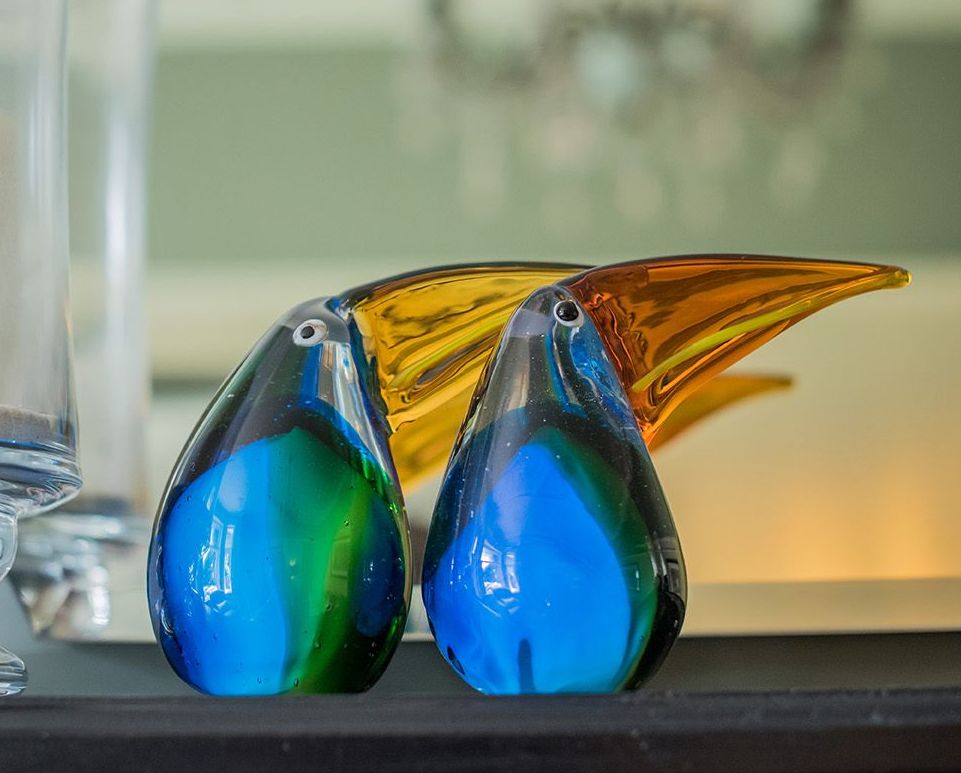 Two blue glass toucans