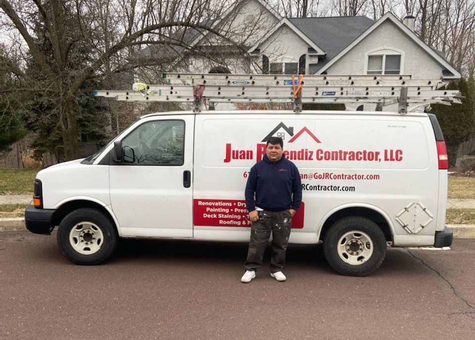 Man standing by white van with company logo 