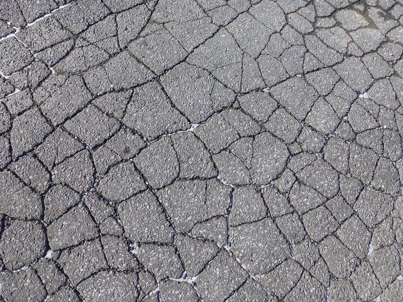 An image of cracked asphalt.