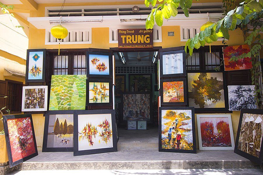 A yellow building with a sign that says trung on it