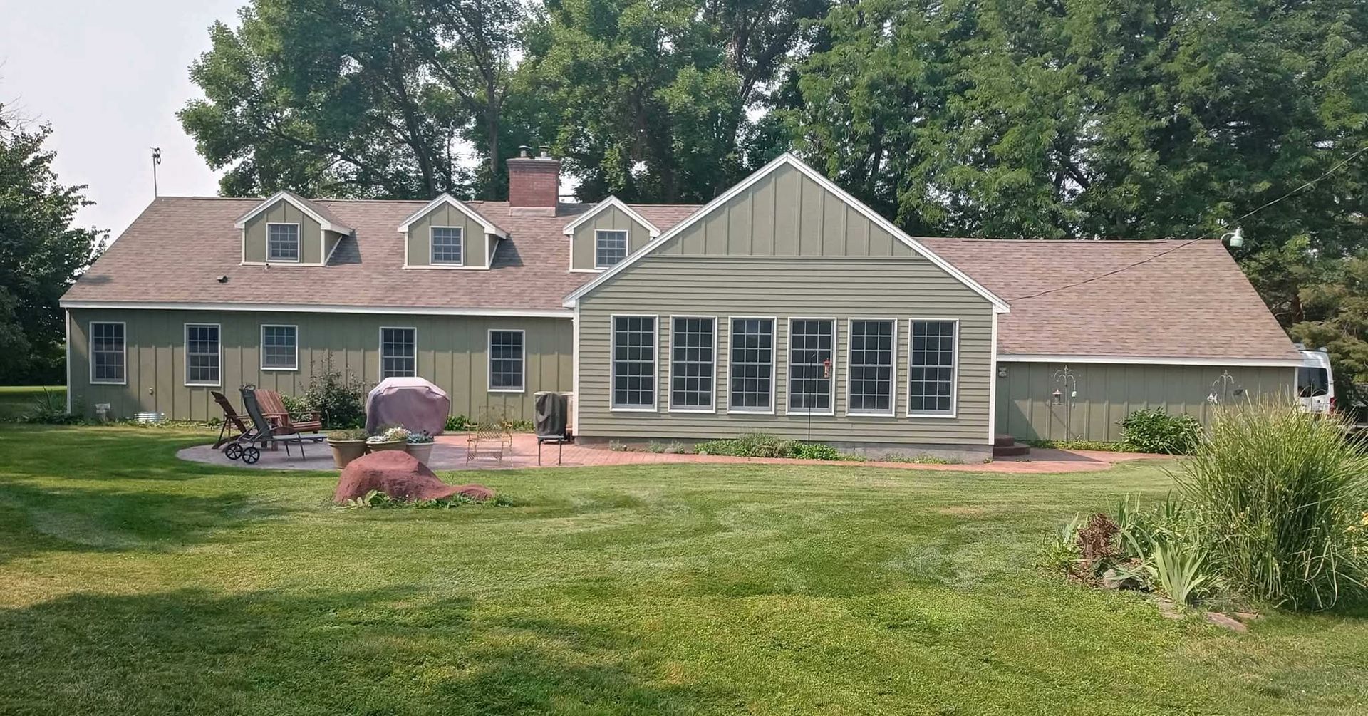 A large house with a large lawn in front of it