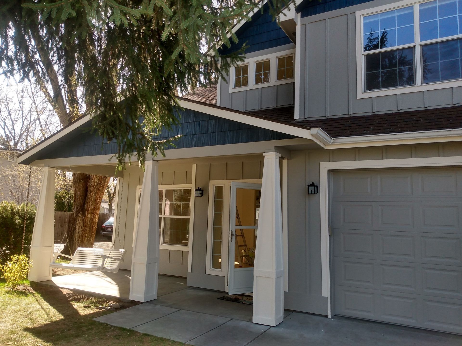The front of a house with a porch and a garage