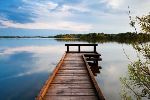 wooden pier on big lake, calm peaceful  view