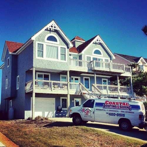 Large House With Car Outside — Powells Point, NC — Coastal Roofing & Siding Inc