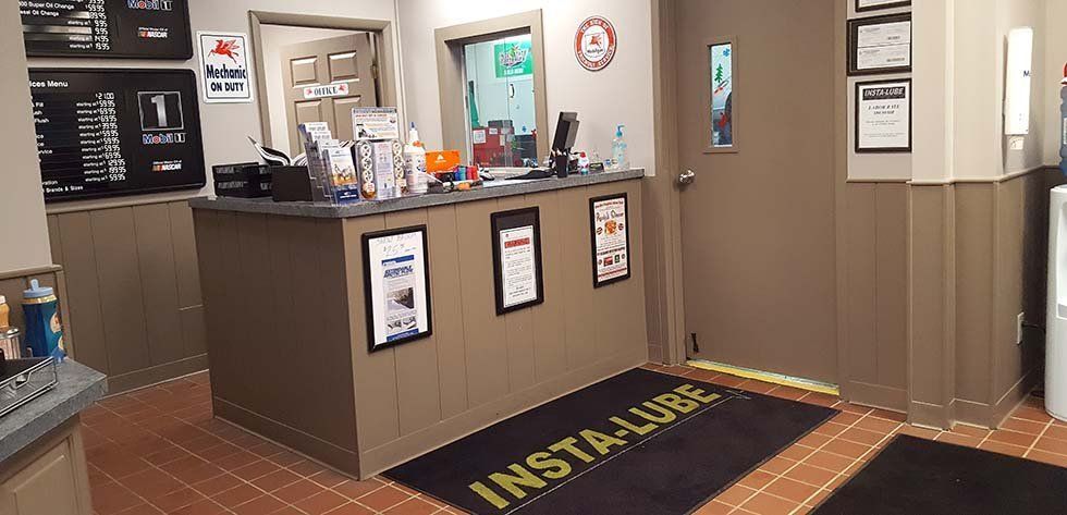 There is a black mat in the middle of the room that says insta lube.