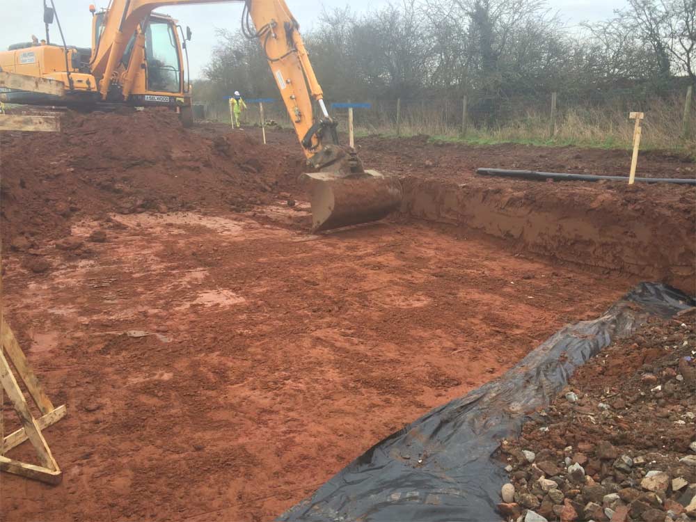Digger digging out land ready for foundations