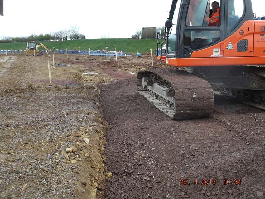 Construction machinery on plot of land