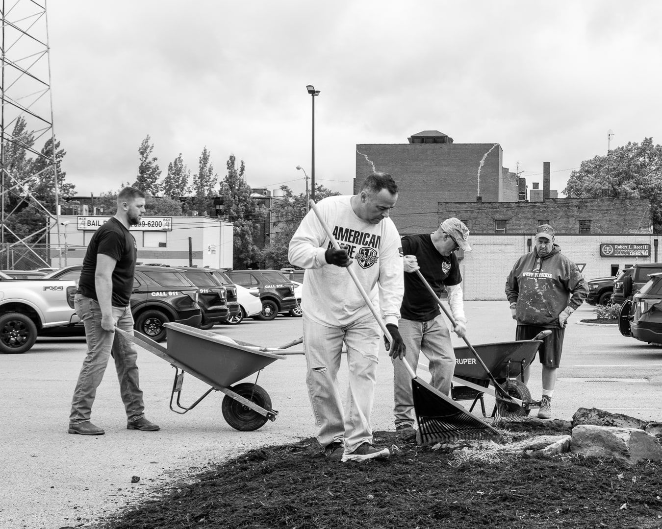 Off-duty City of Warren, Ohio, police officers beautifying the landscape at the Municipal Building. 