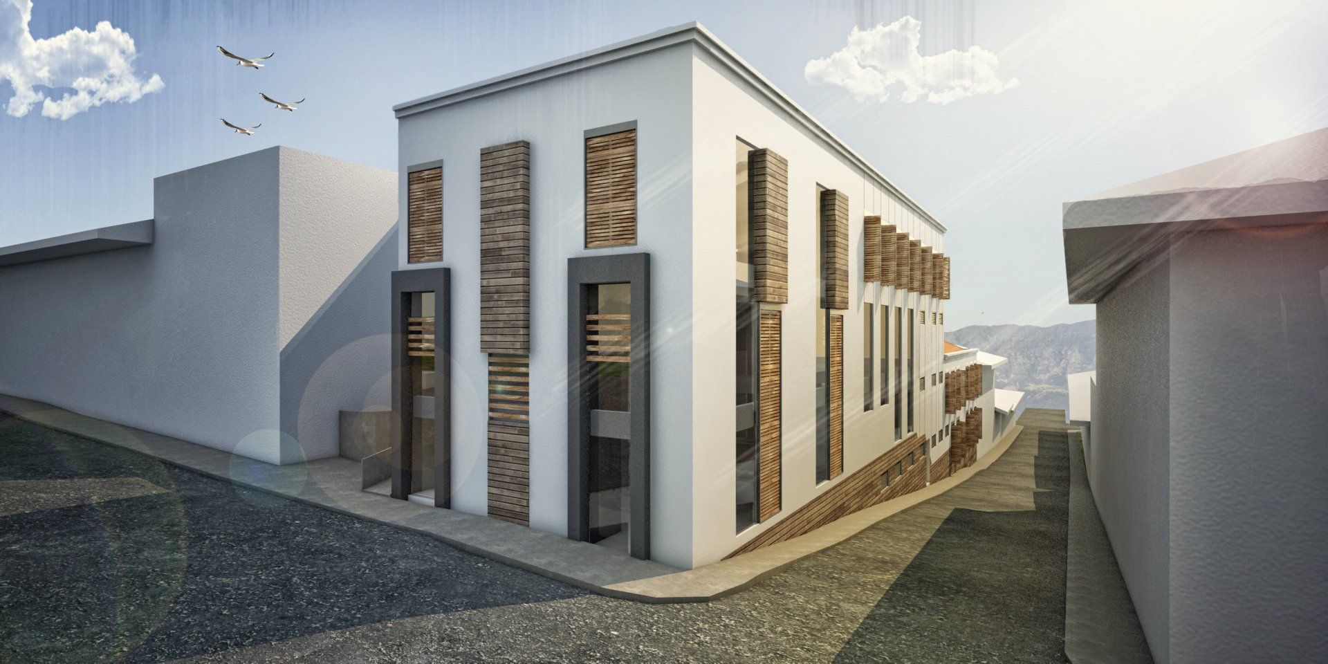 Un edificio blanco con muchas ventanas se encuentra en la esquina de una calle.