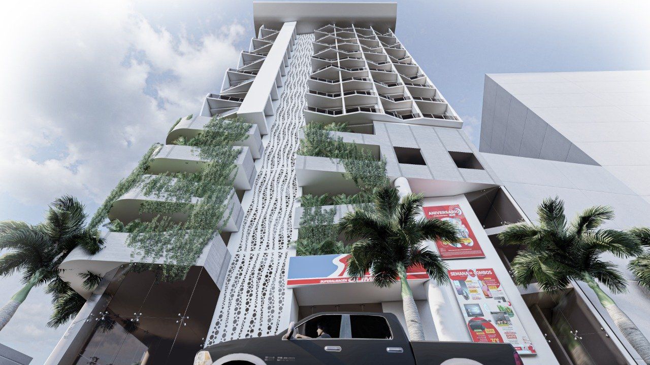 Un camión está estacionado frente a un edificio alto.