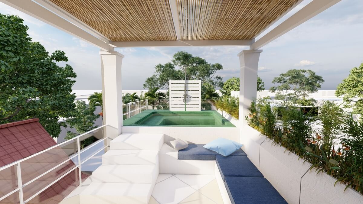 Un balcón con un sofá y una piscina al fondo.