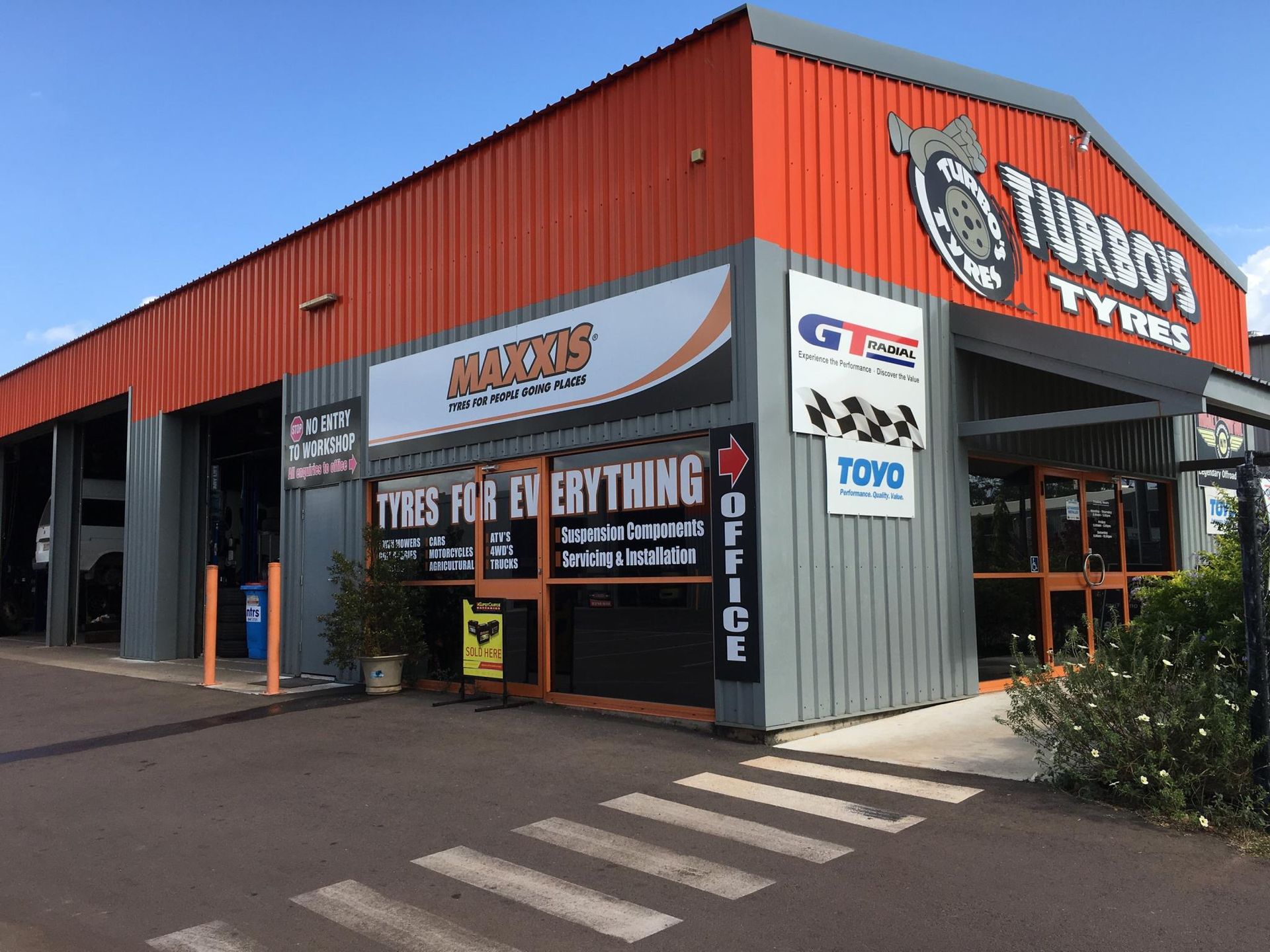A Tire is Sitting on Top of a Machine in a Garage — Turbo's Tyres Pty Ltd In Humpty Doo, NT