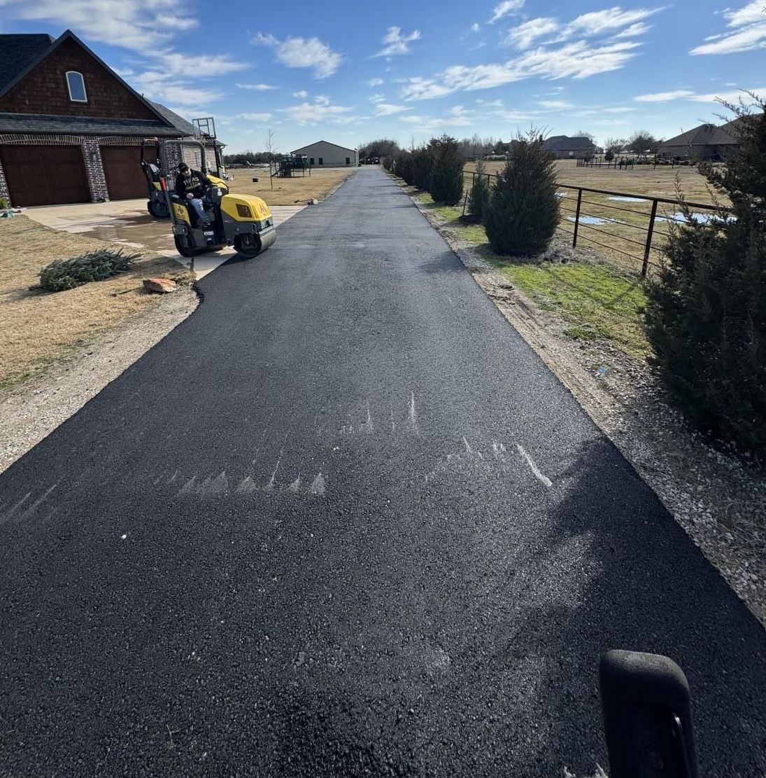 Image of a driveway being repaired and resealed.