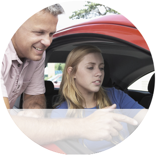 A man explaining something to a young girl