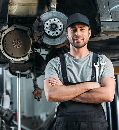 Mechanic Posing with Crossed Arms in Auto Mechanic Shop — New Britain, CT — The Transmission Works