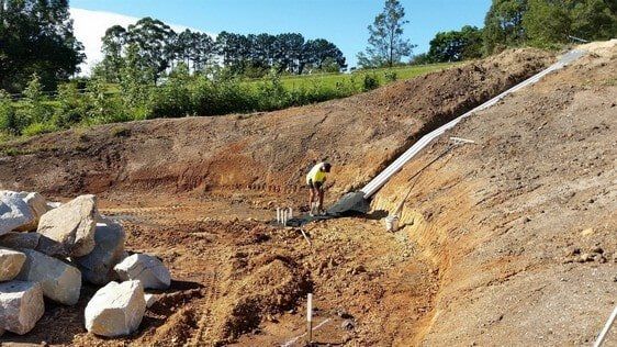 Land with Grass Excavating — Earthmoving Services  in Eungai Creek, NSW