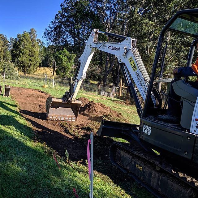 Man Excavating Land — Earthmoving Services  in Eungai Creek, NSW
