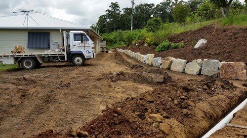Truck Beside House — Earthmoving Services  in Eungai Creek, NSW