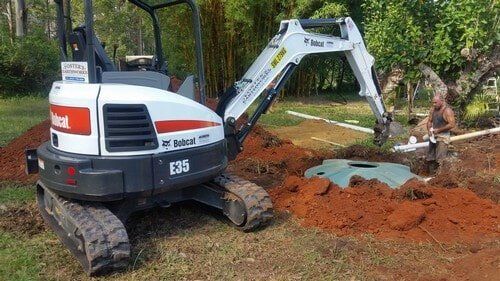 White Excavator Digging Hole — Earthmoving Services  in Eungai Creek, NSW