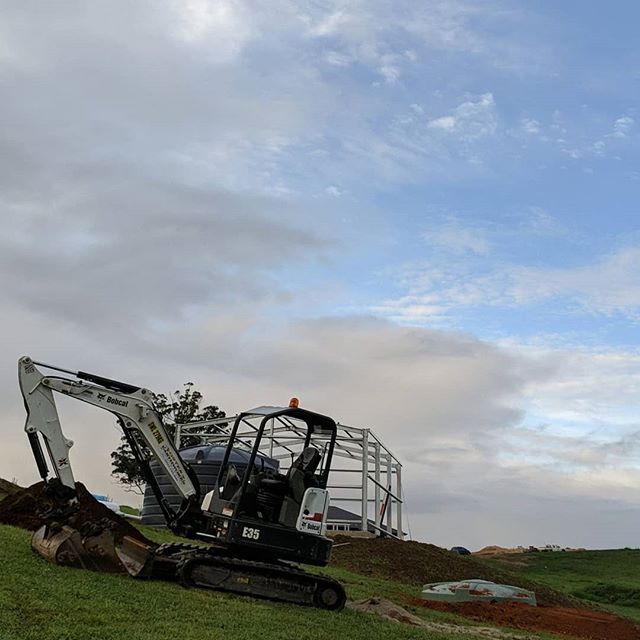 White Excavator and Tank — Earthmoving Services  in Eungai Creek, NSW