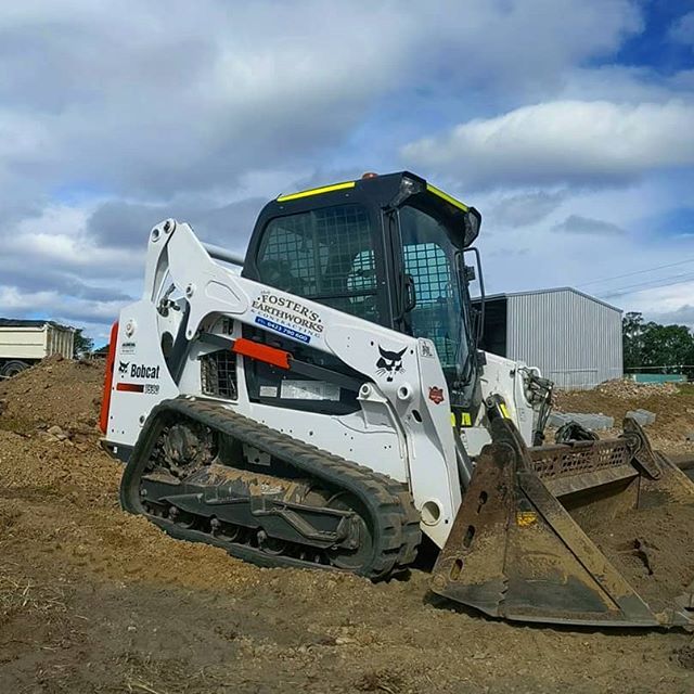 White Excavator at Rest — Earthmoving Services  in Eungai Creek, NSW