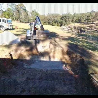 White Excavator Doing Earthworks — Earthmoving Services  in Eungai Creek, NSW