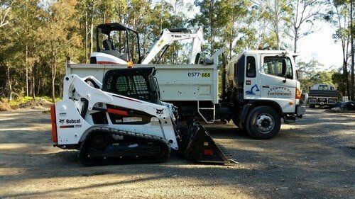 White Truck and Excavator — Earthmoving Services  in Eungai Creek, NSW