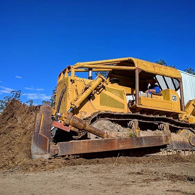 Yellow Excavator Digging — Earthmoving Services  in Eungai Creek, NSW